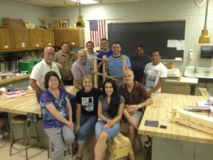 Group photo in a wood shop.