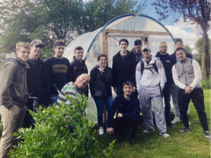 Students learning about specialized automated structures regulate the internal temperature and humidity to maximize plant growth in Ballymun.