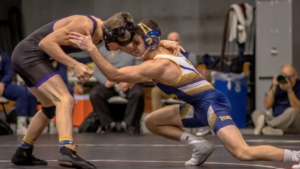 TCNJ Wrestler playing in an official match.