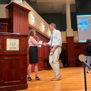 A photo of a student accepting an award.