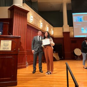 A photo of a student accepting an award.