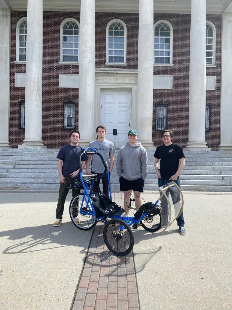 Tyler Griffin, Frank Battaglia, Matt Martinez and Will Heidelberger with their human powered vehicle